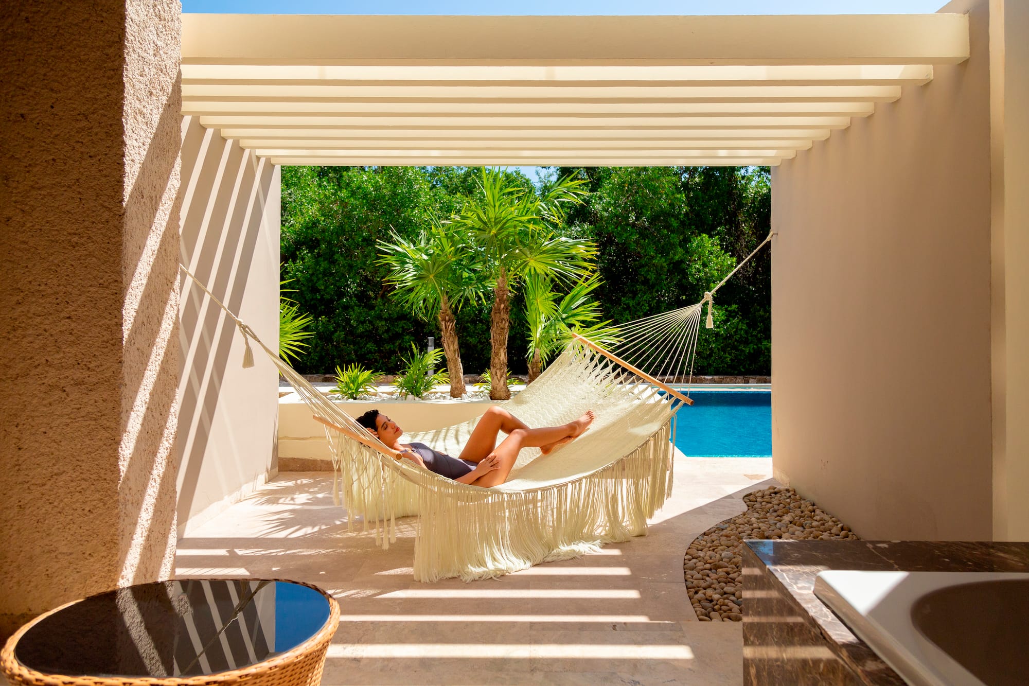 a woman lying in a hammock