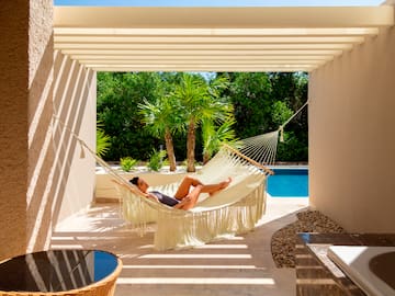 a woman lying in a hammock