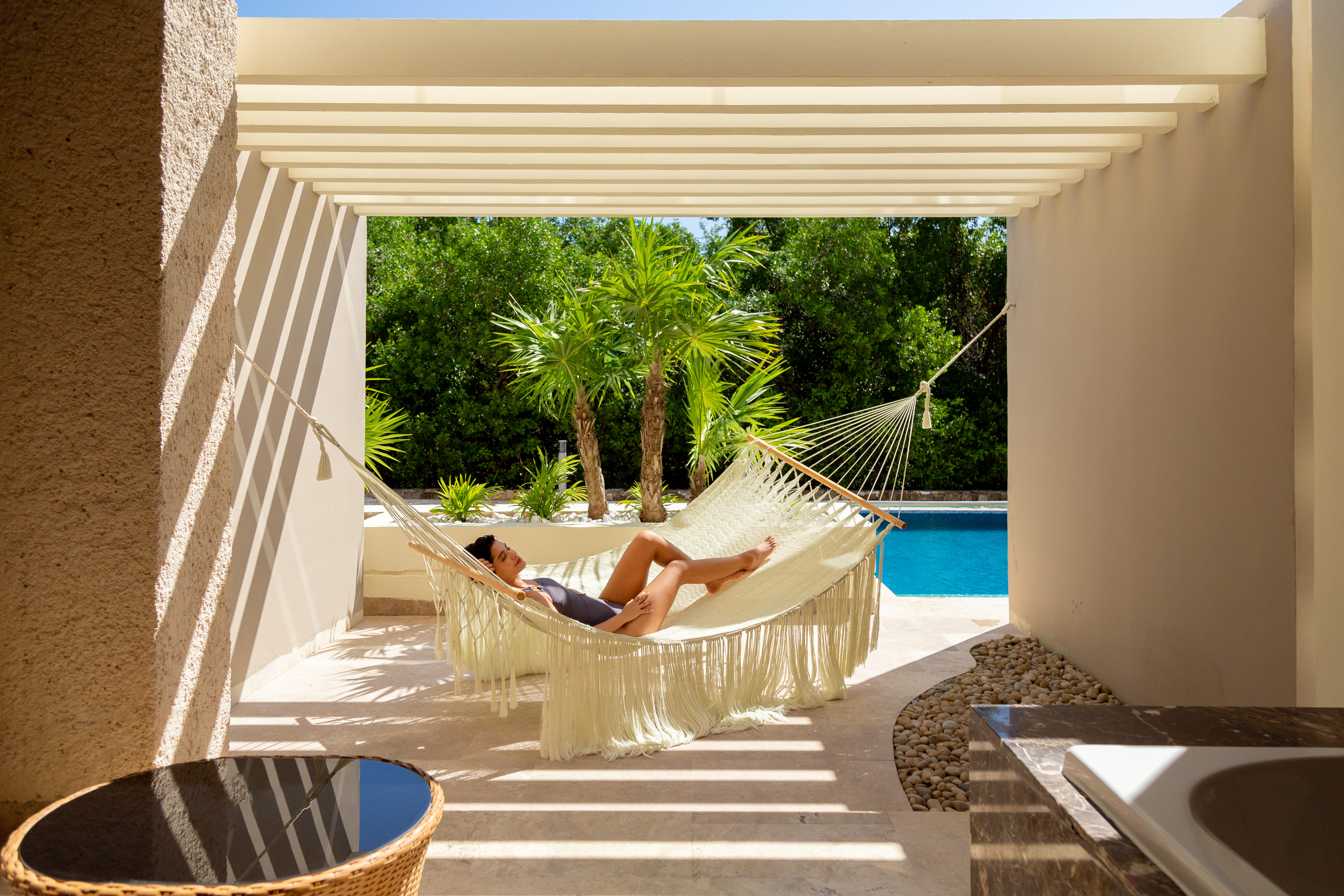a woman lying in a hammock