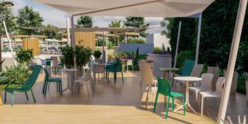 a patio with tables and chairs