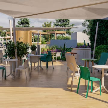 a patio with tables and chairs