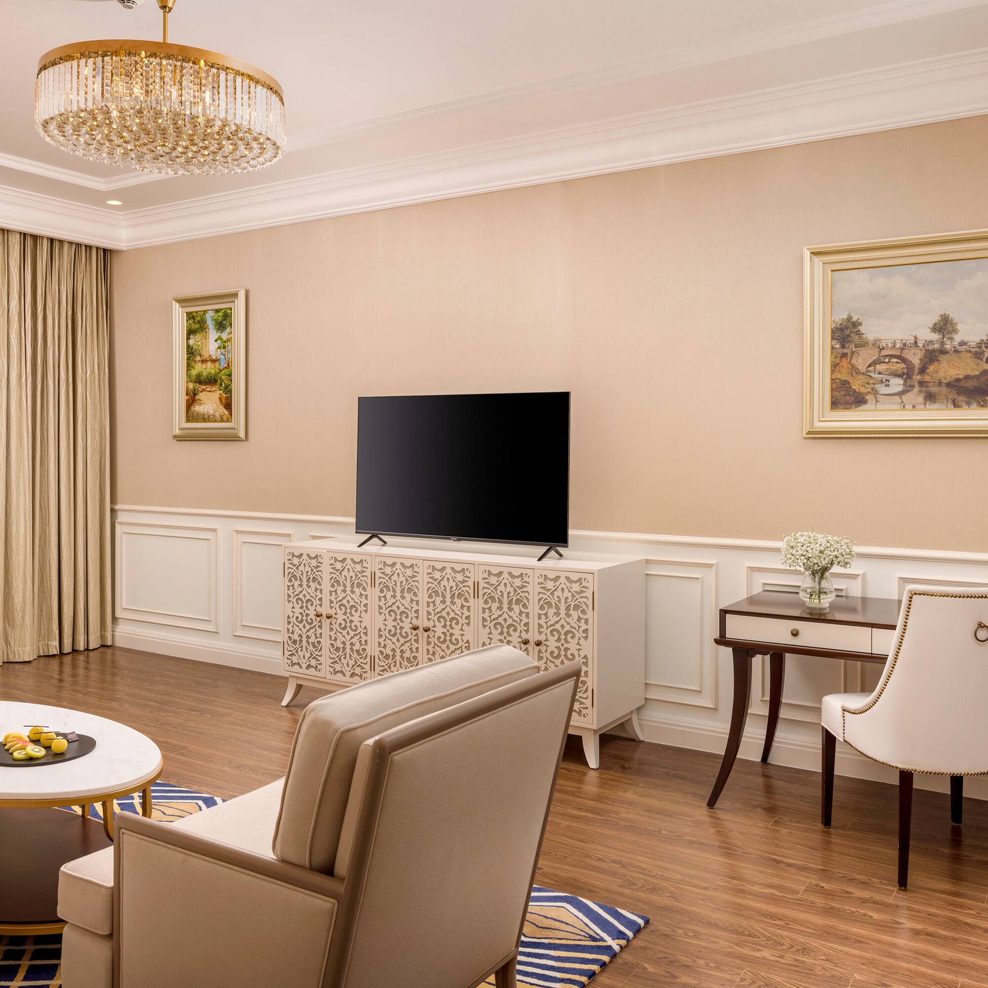 a living room with a television and a table