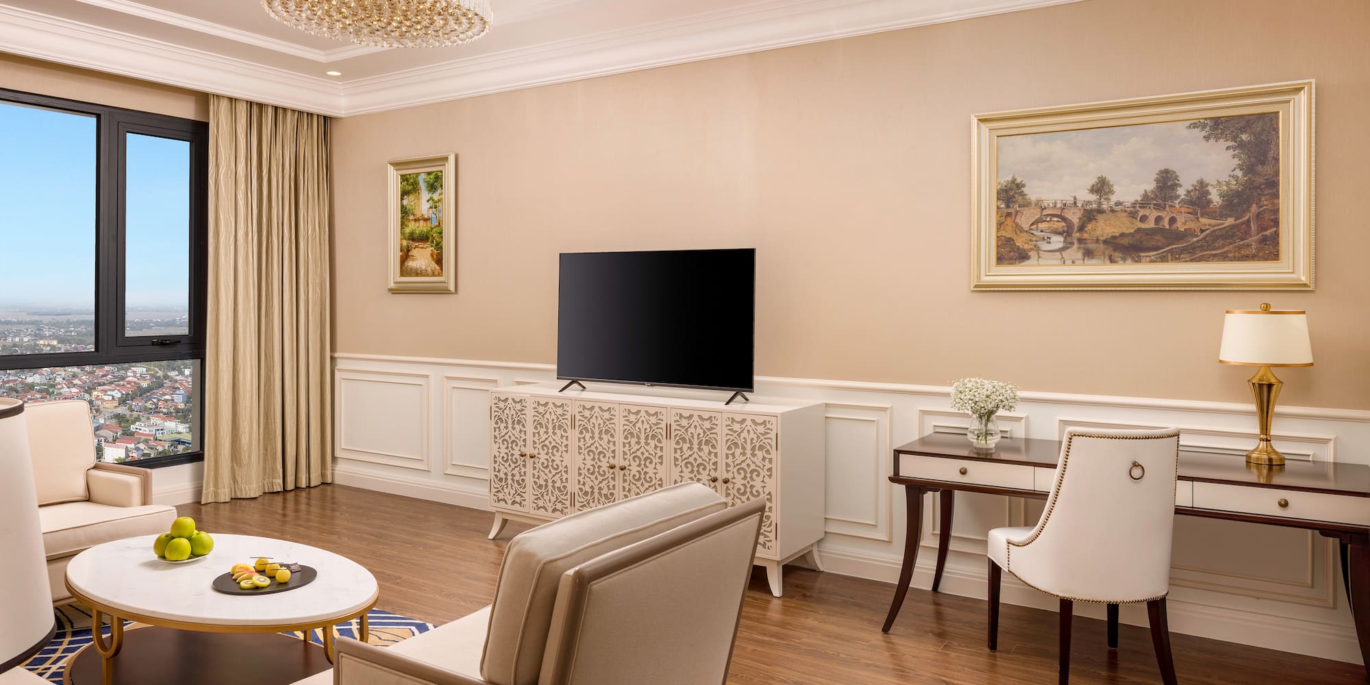 a living room with a television and a table