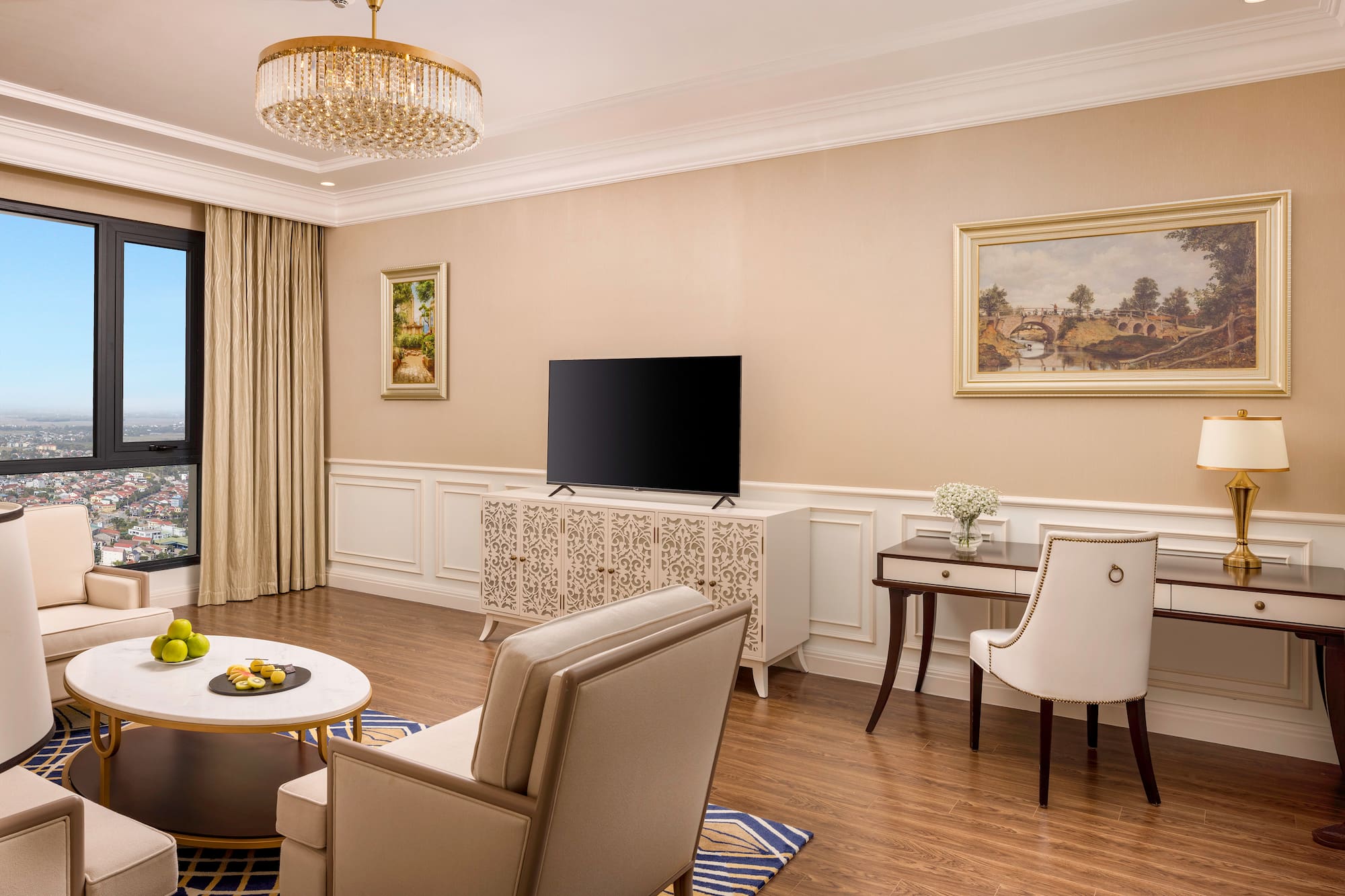 a living room with a television and a table