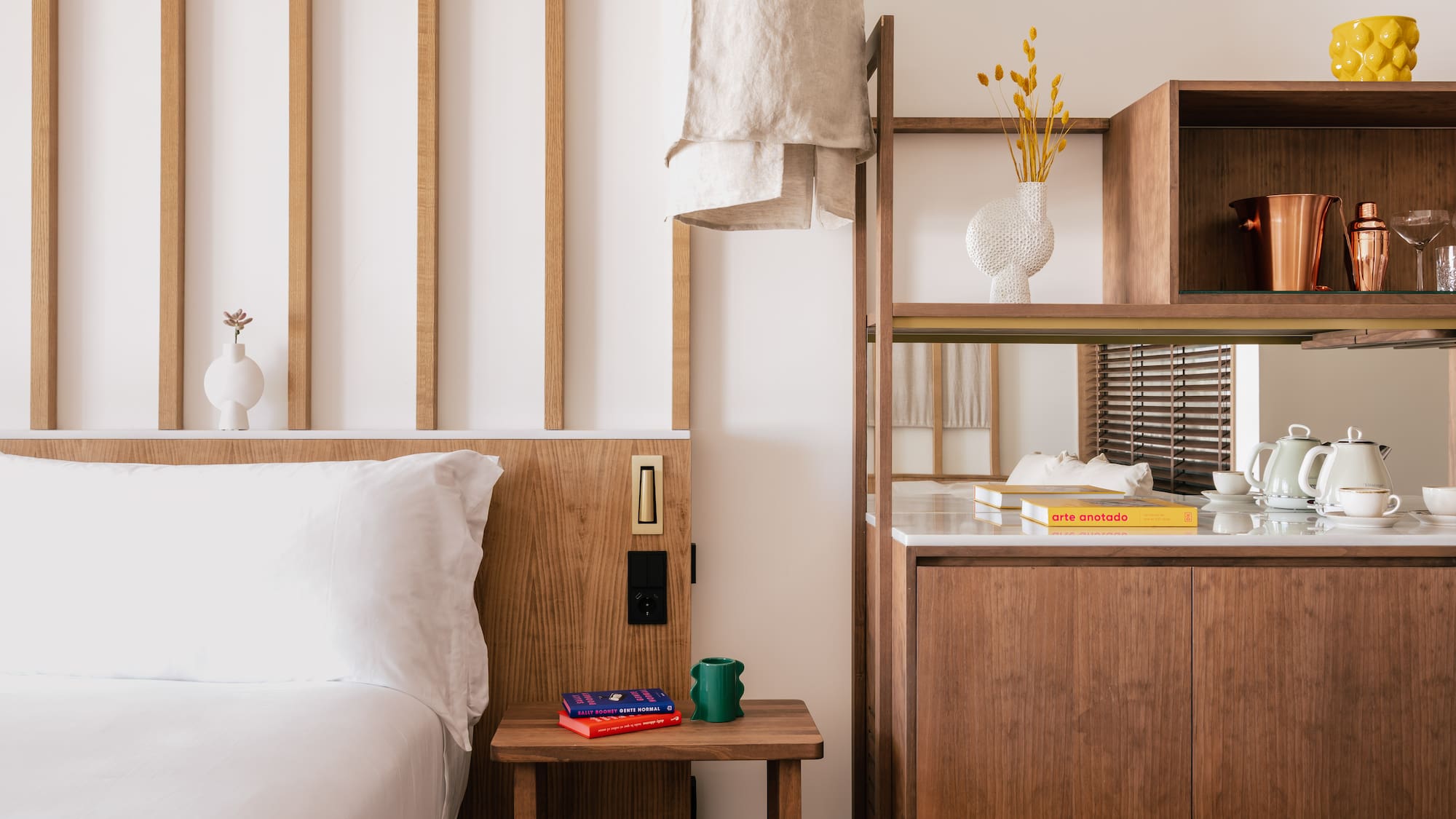 a bedroom with a bed and shelves