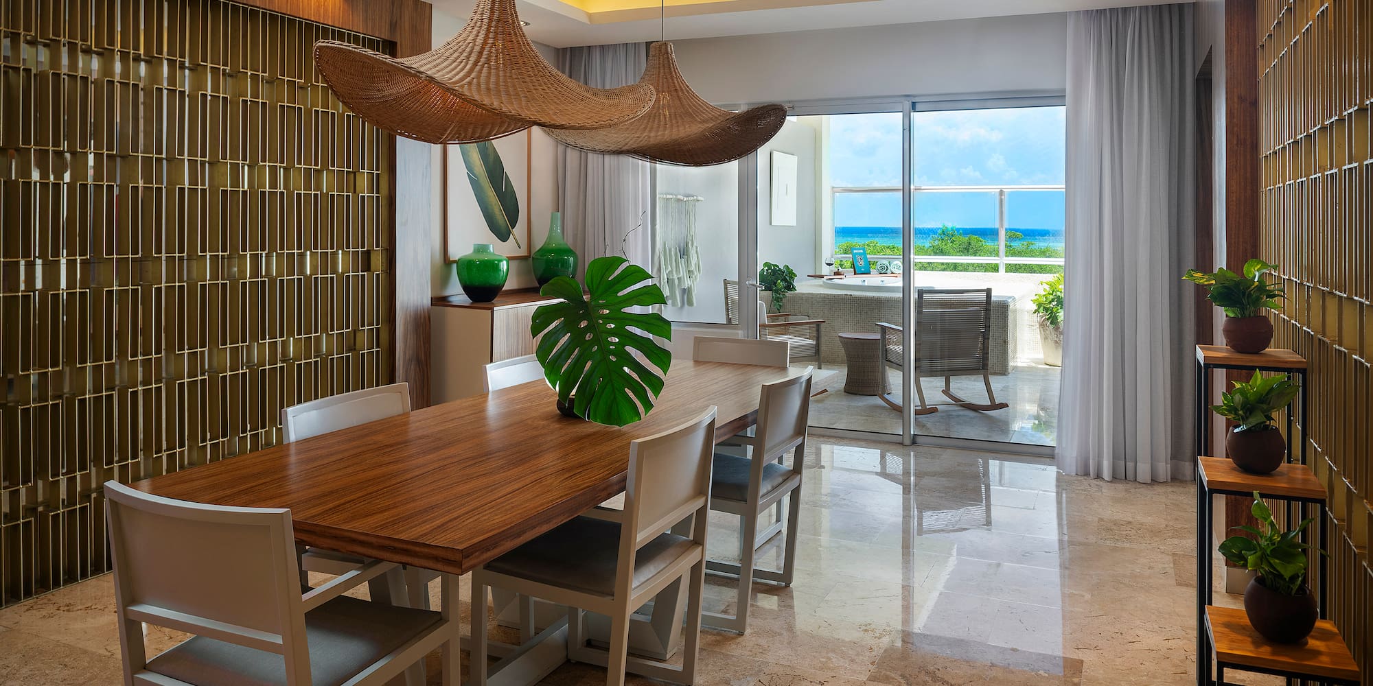 a dining room with a table and chairs