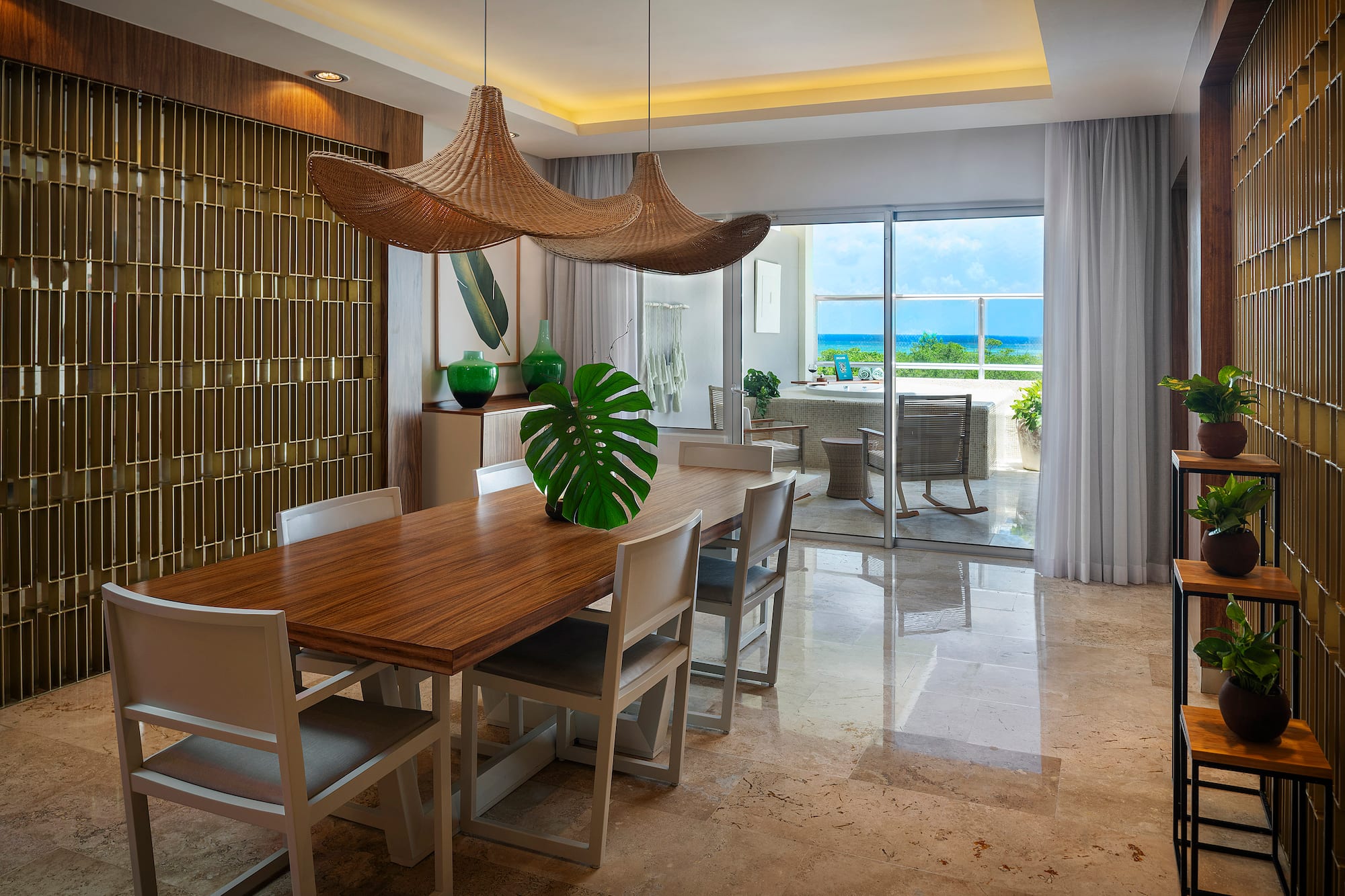 a dining room with a table and chairs