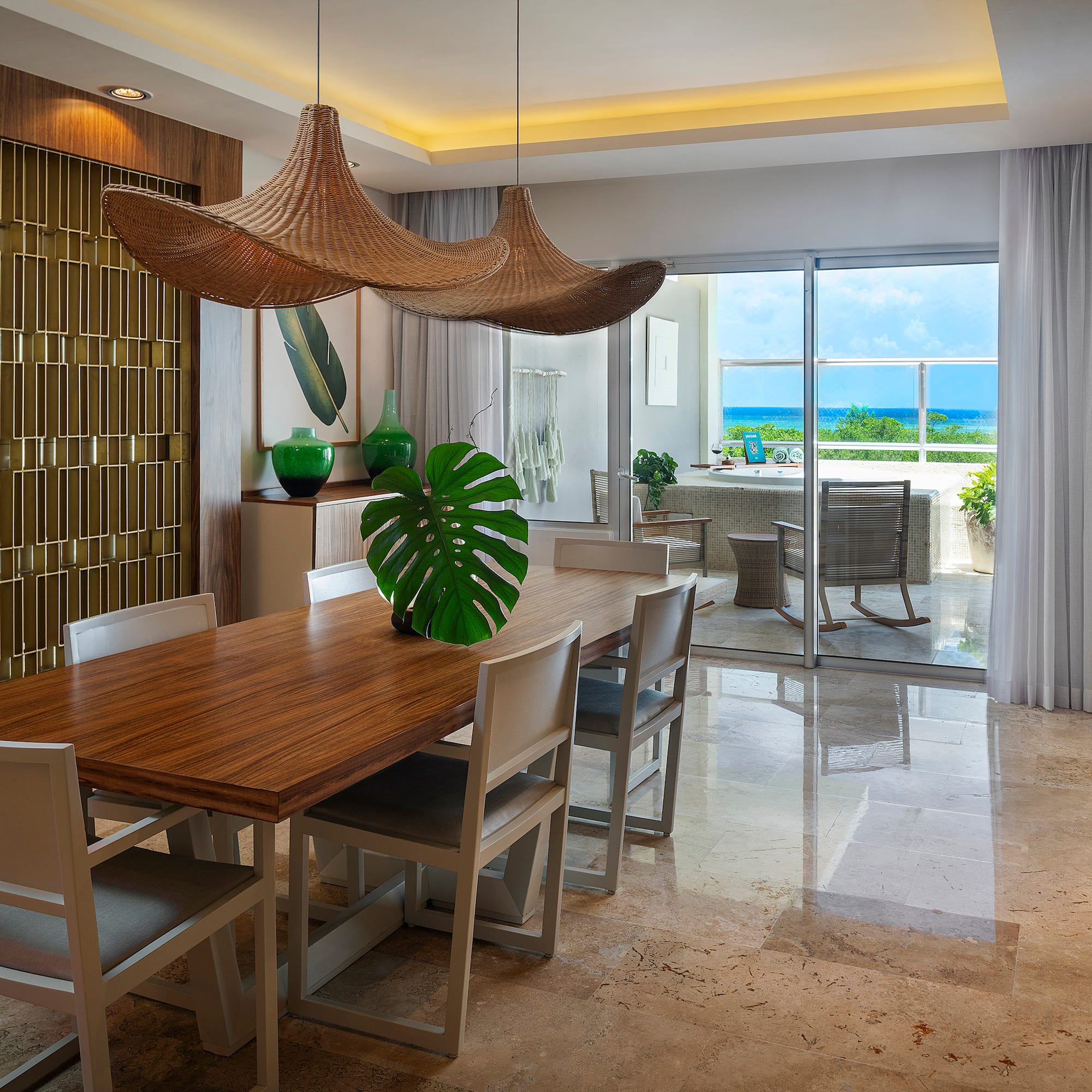 a dining room with a table and chairs