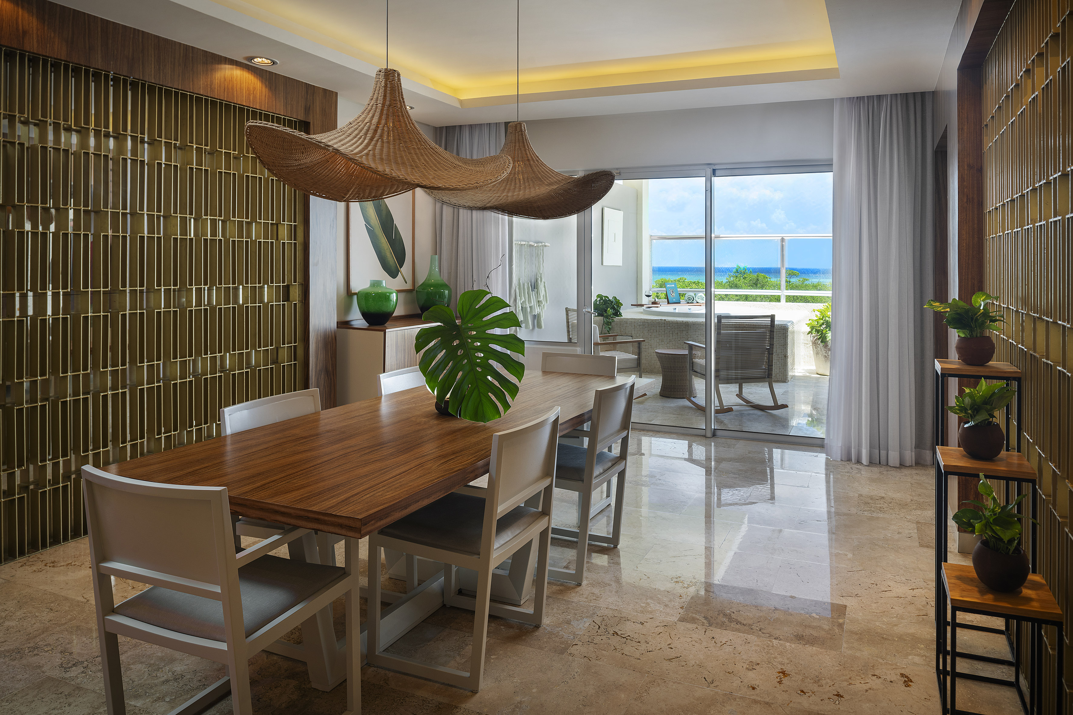 a dining room with a table and chairs