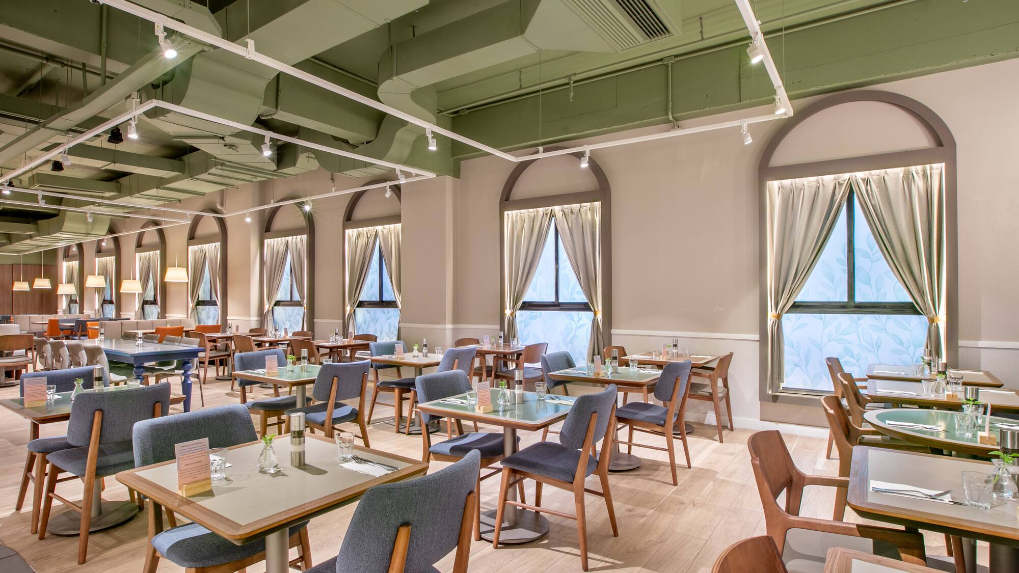 a room with tables and chairs