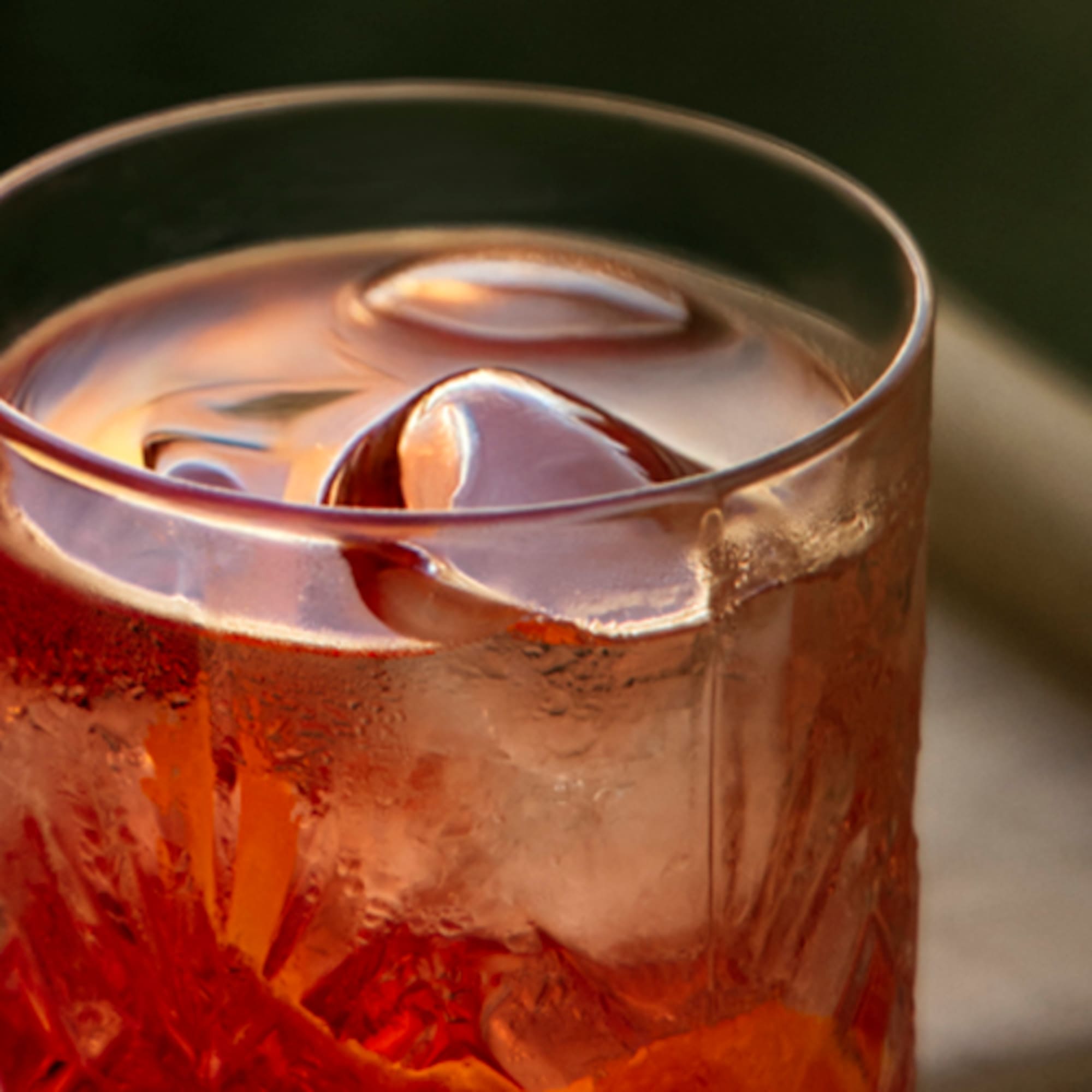 a glass with a drink and ice