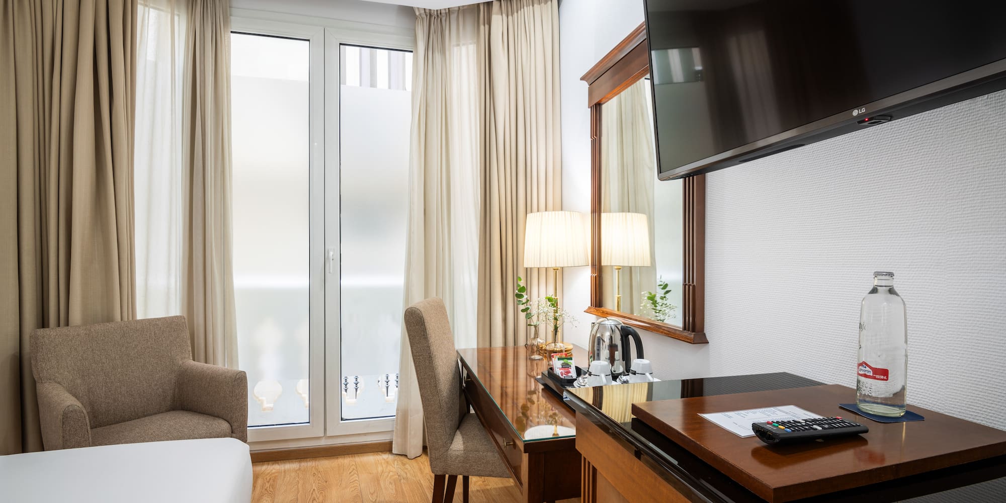 a room with a tv and a desk