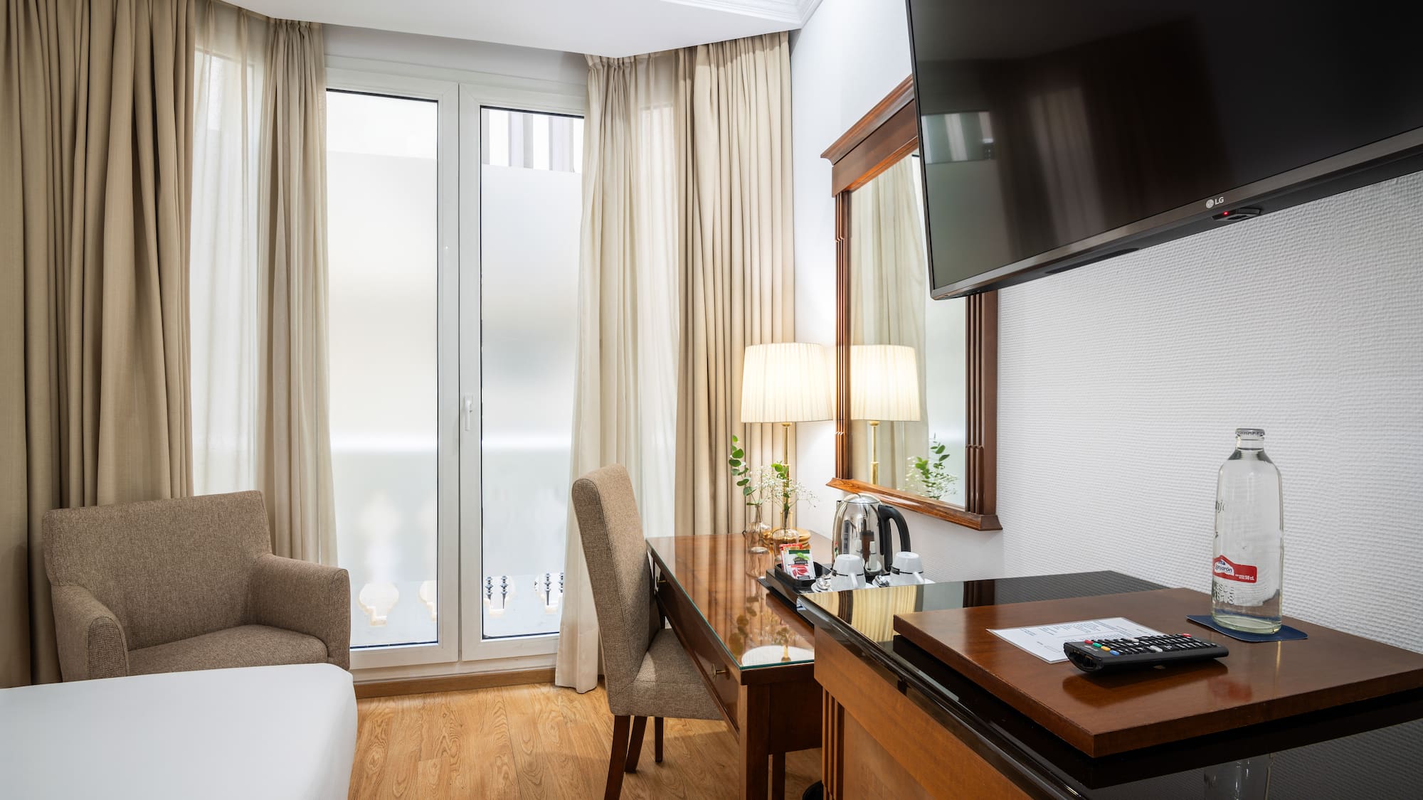 a room with a tv and a desk