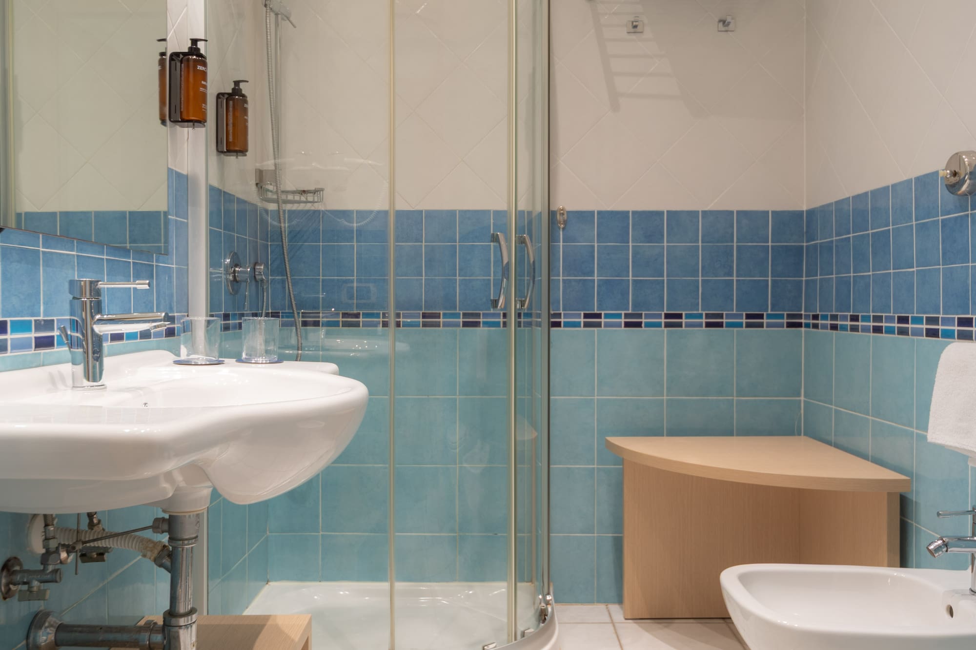 a bathroom with blue tiles
