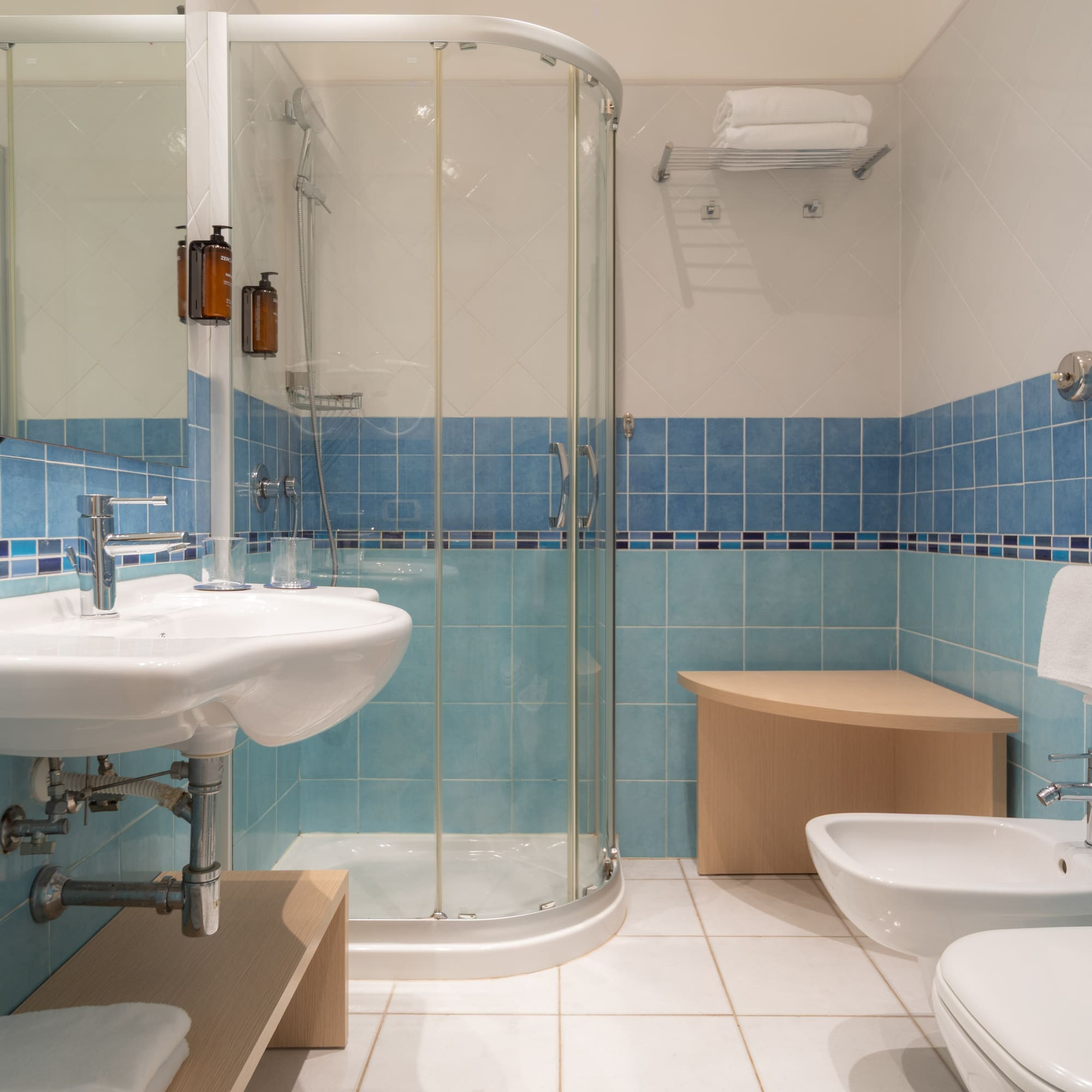 a bathroom with blue tiles