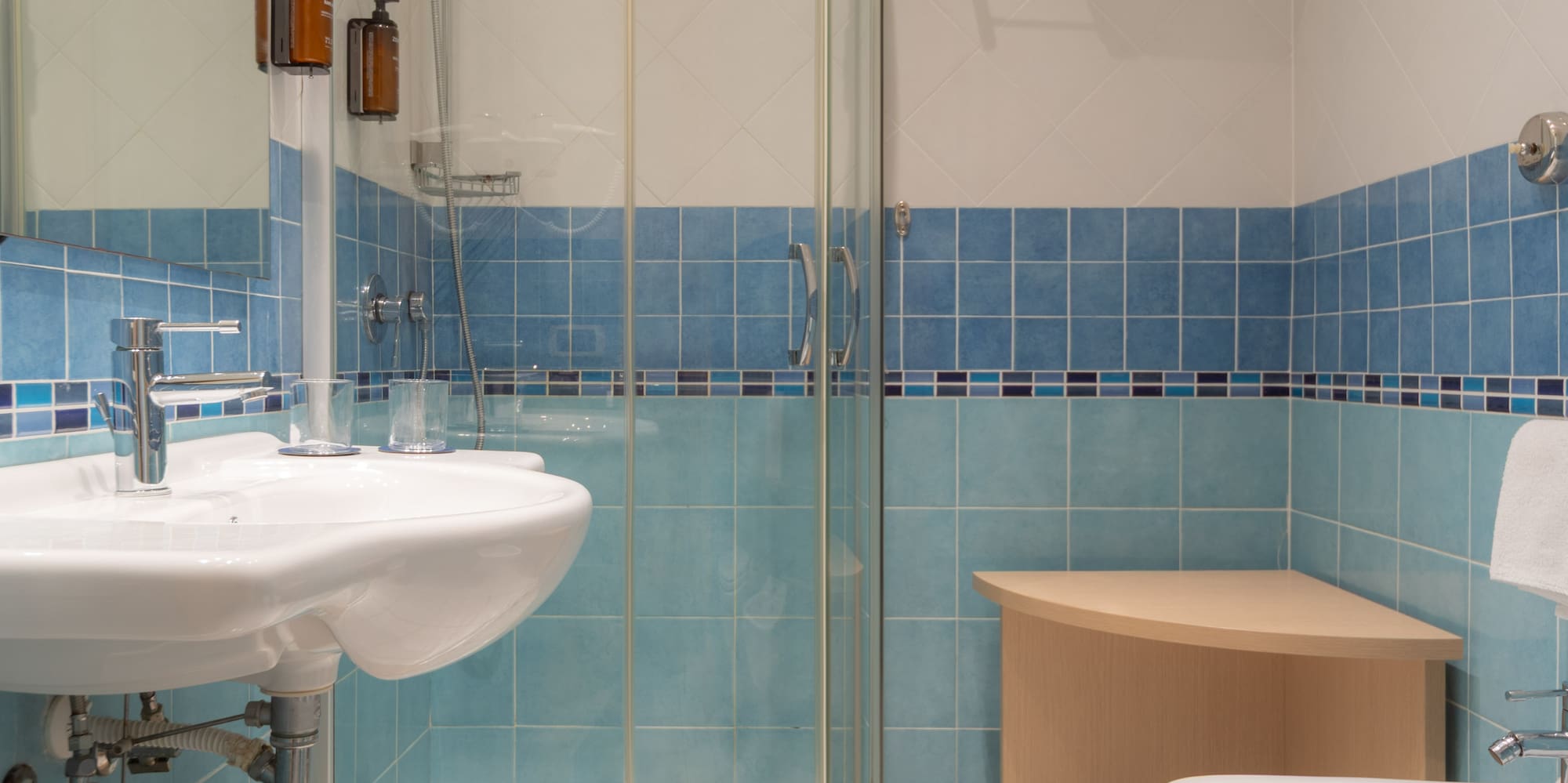 a bathroom with blue tiles