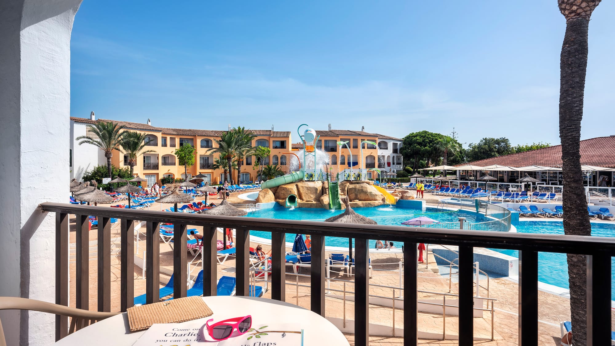a pool with a table and chairs