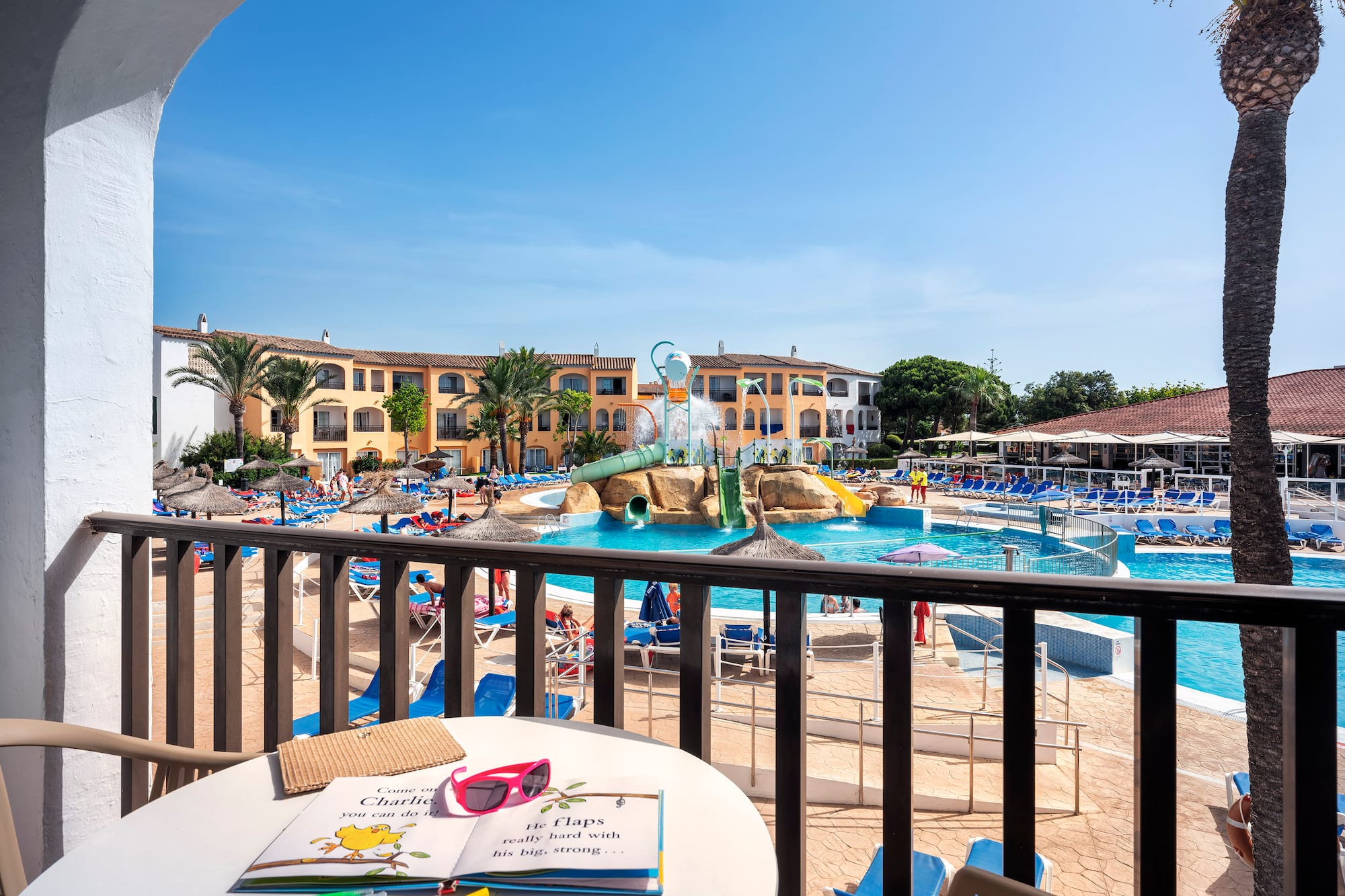 a pool with a table and chairs