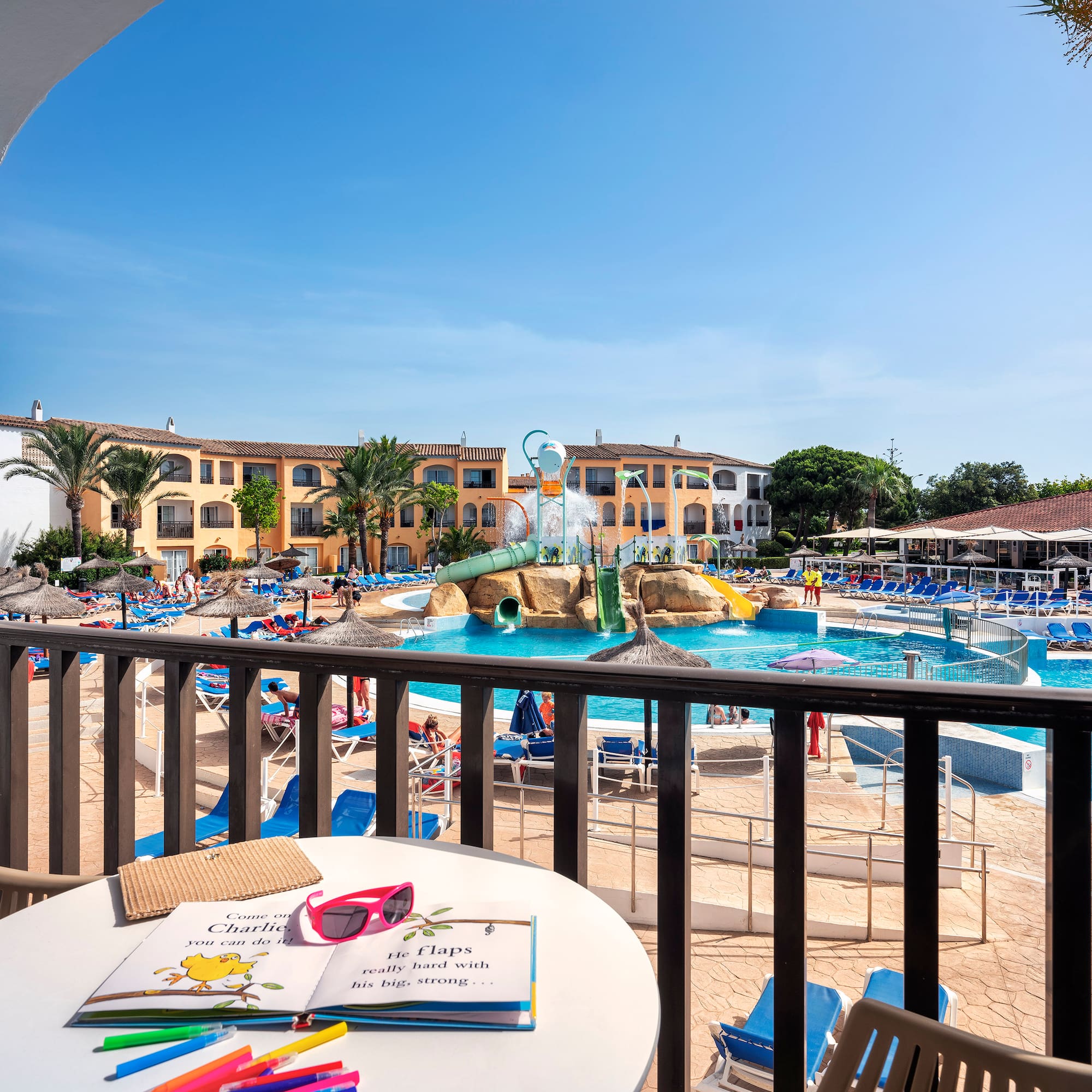 a pool with a table and chairs