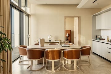 a room with a table and chairs