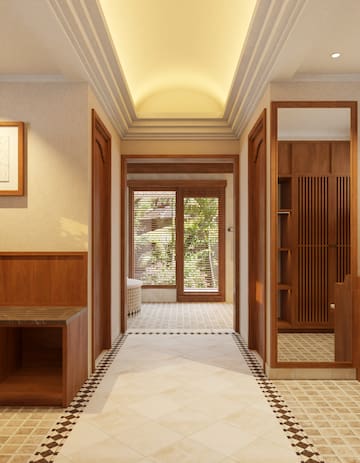 a hallway with wood doors and a glass door