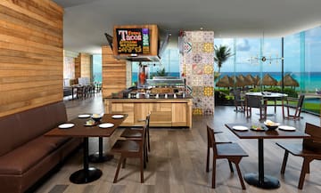 a restaurant with tables and chairs