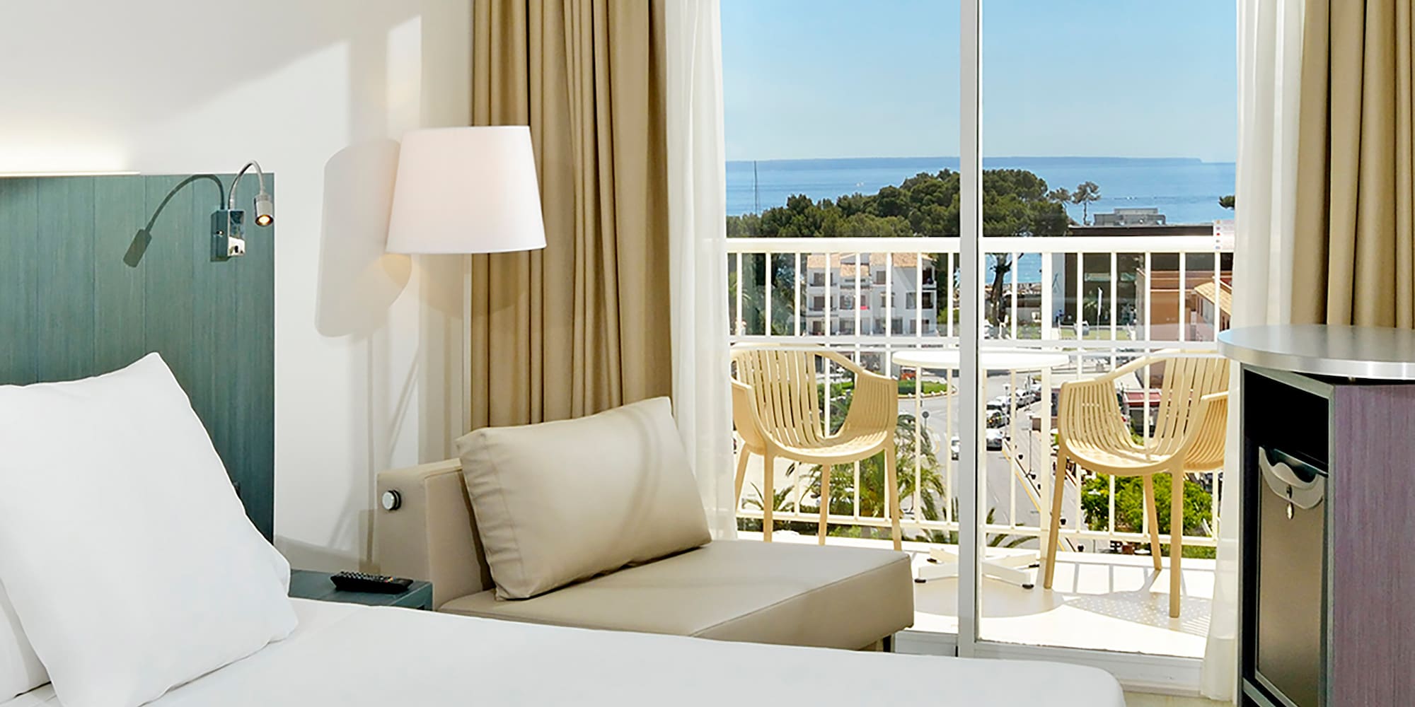 a room with a balcony and a bed