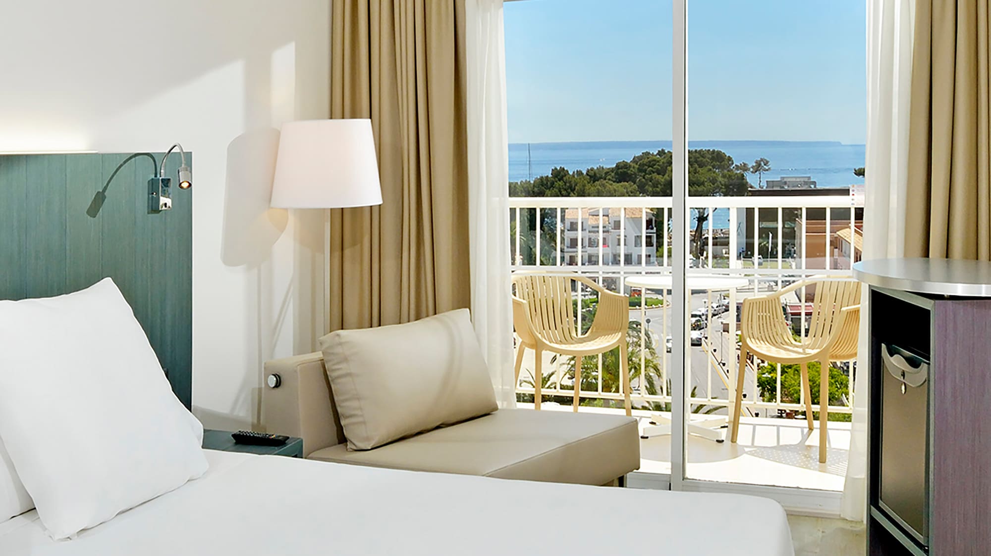 a room with a balcony and a bed