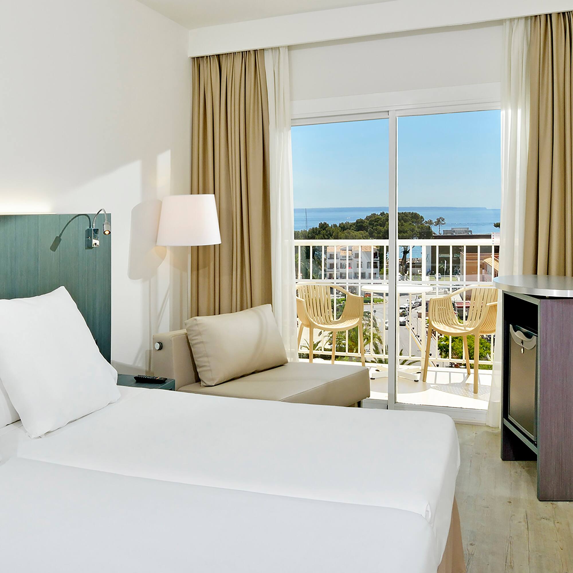 a room with a balcony and a bed