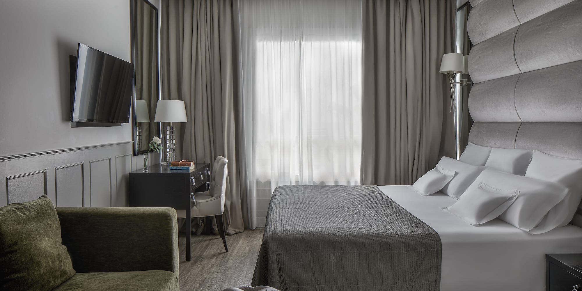 a room with a bed and a chair