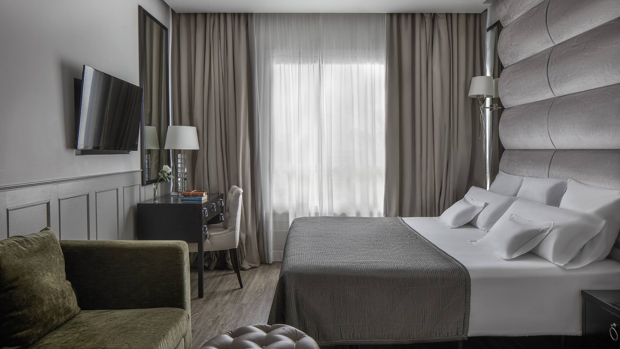 a room with a bed and a chair