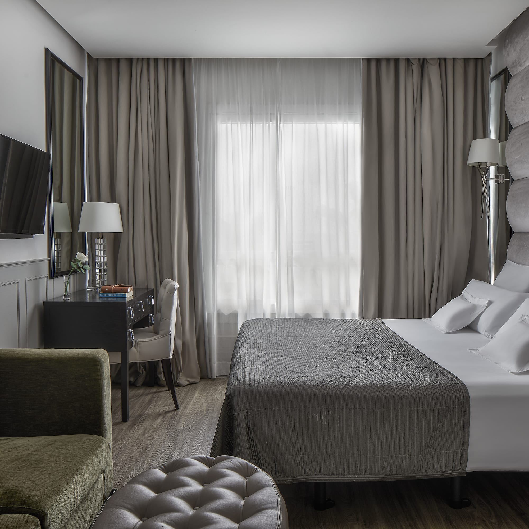 a room with a bed and a chair