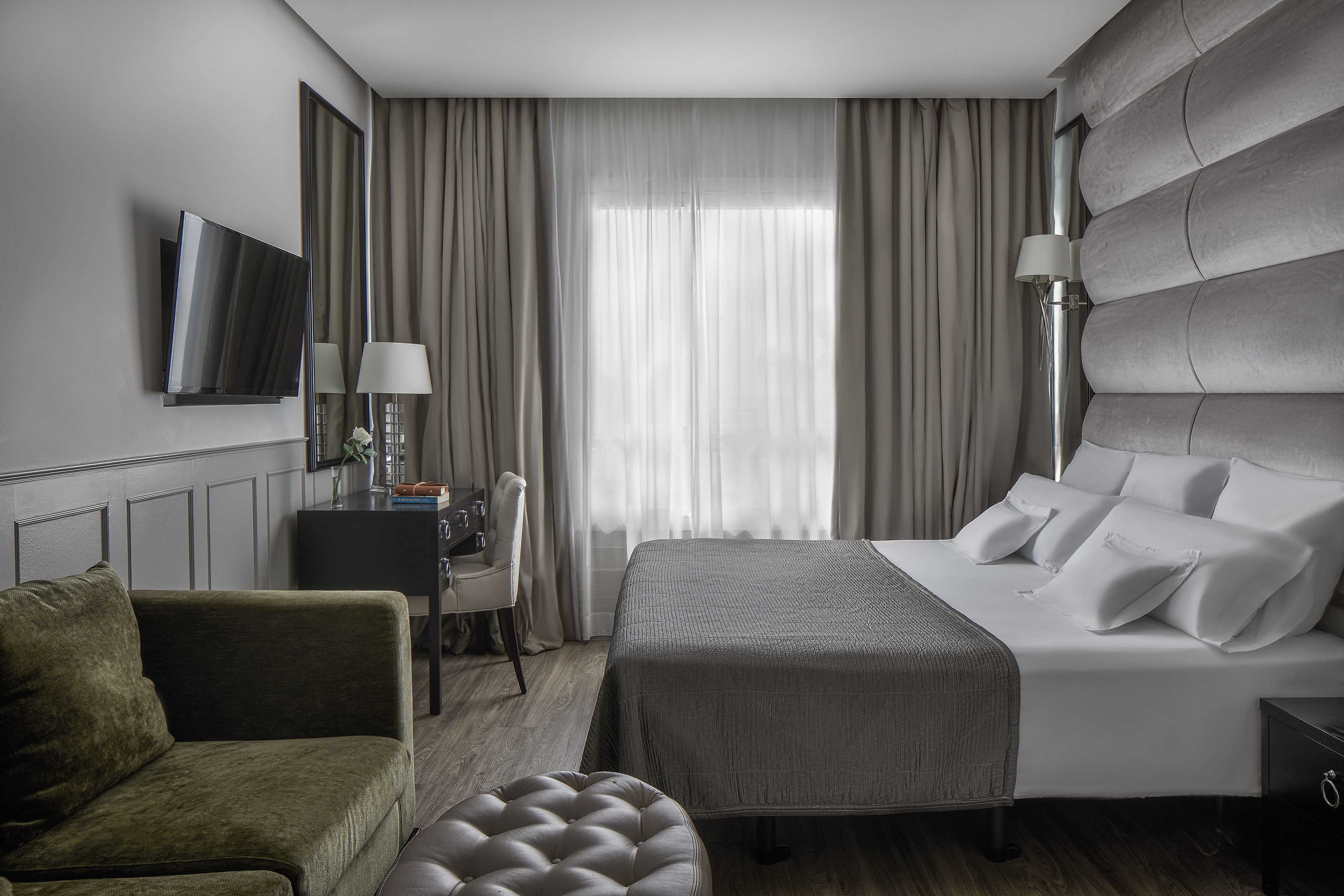 a room with a bed and a chair