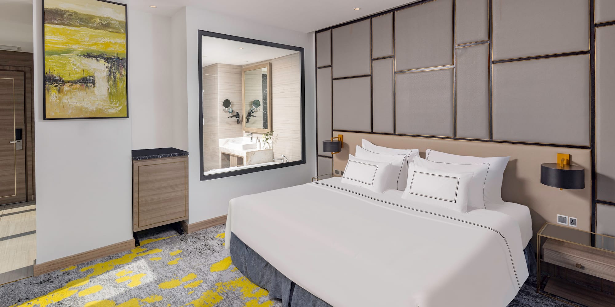 a bedroom with a bed and a mirror