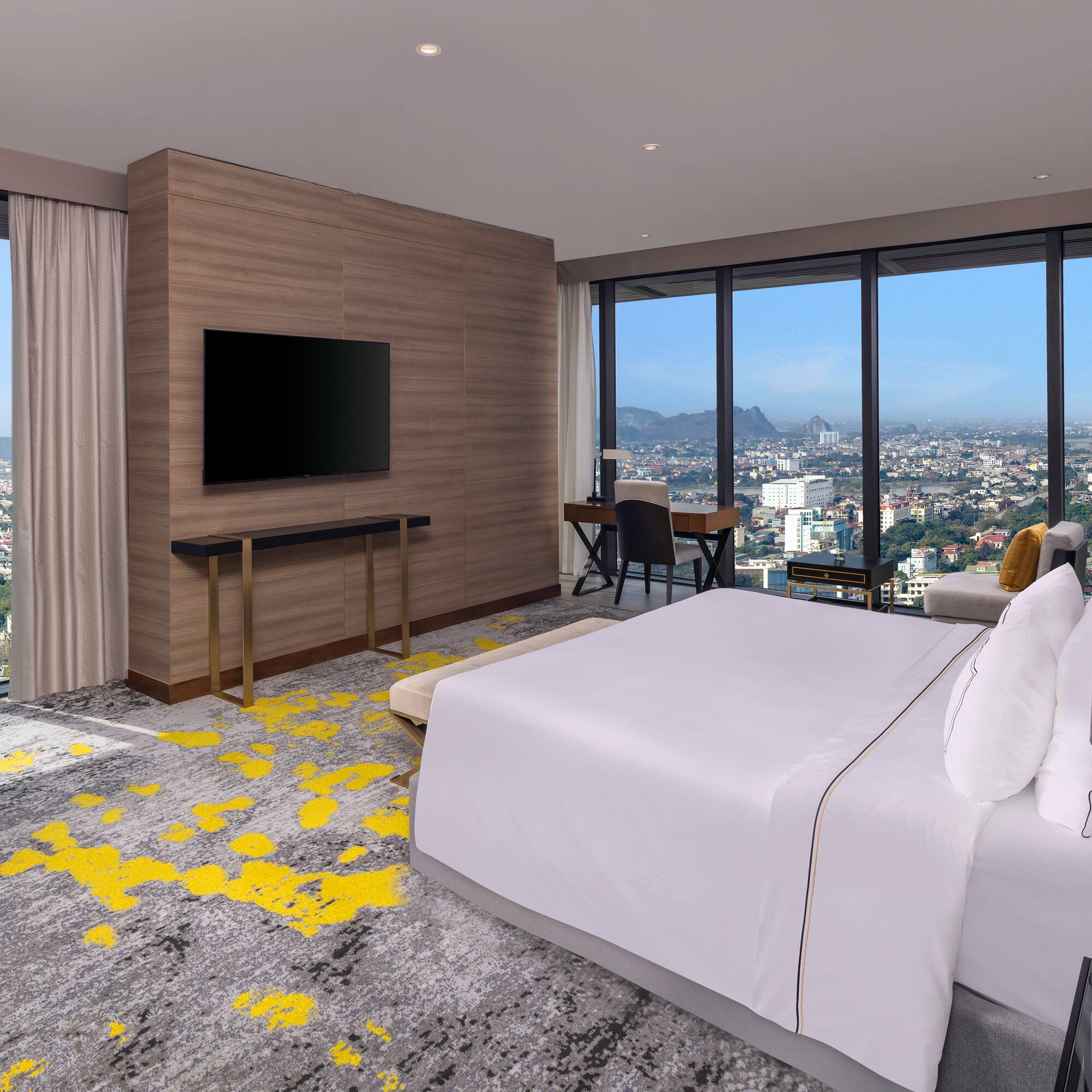 a room with a large window and a large bed