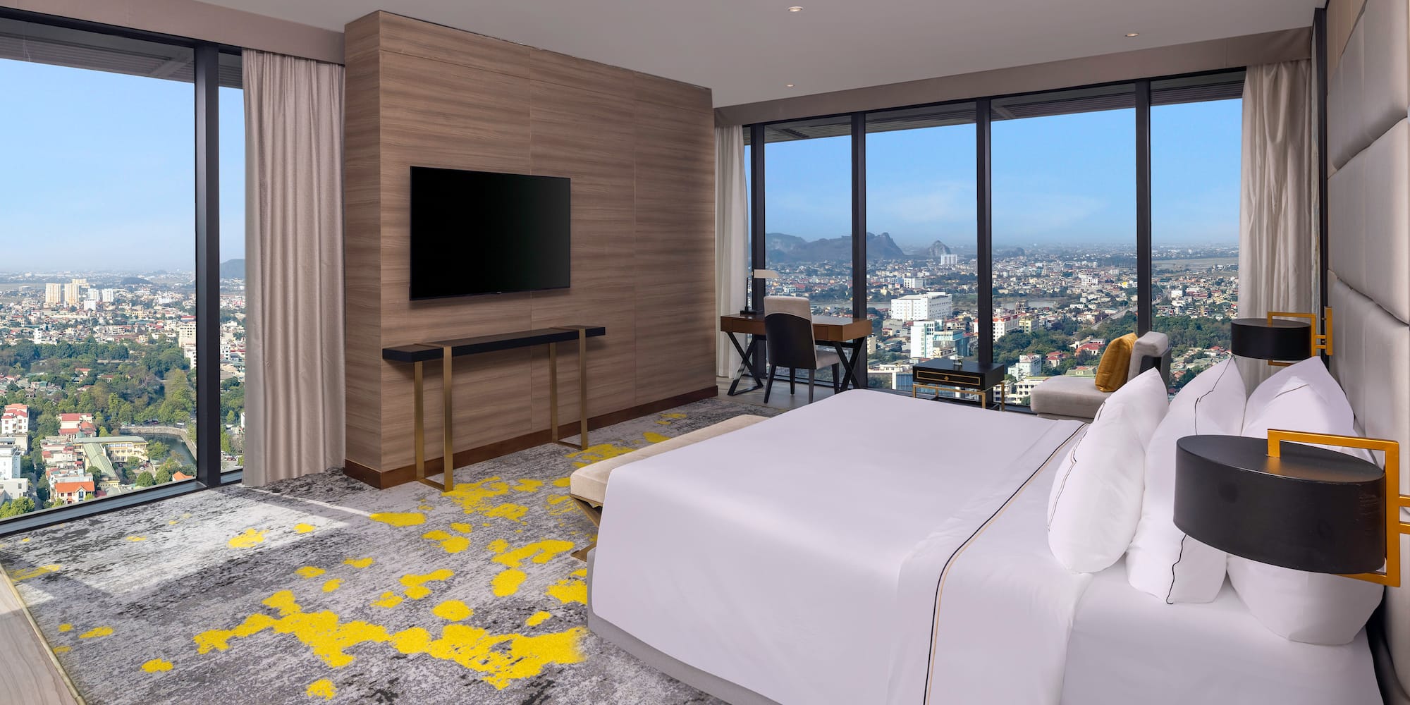 a room with a large window and a large bed