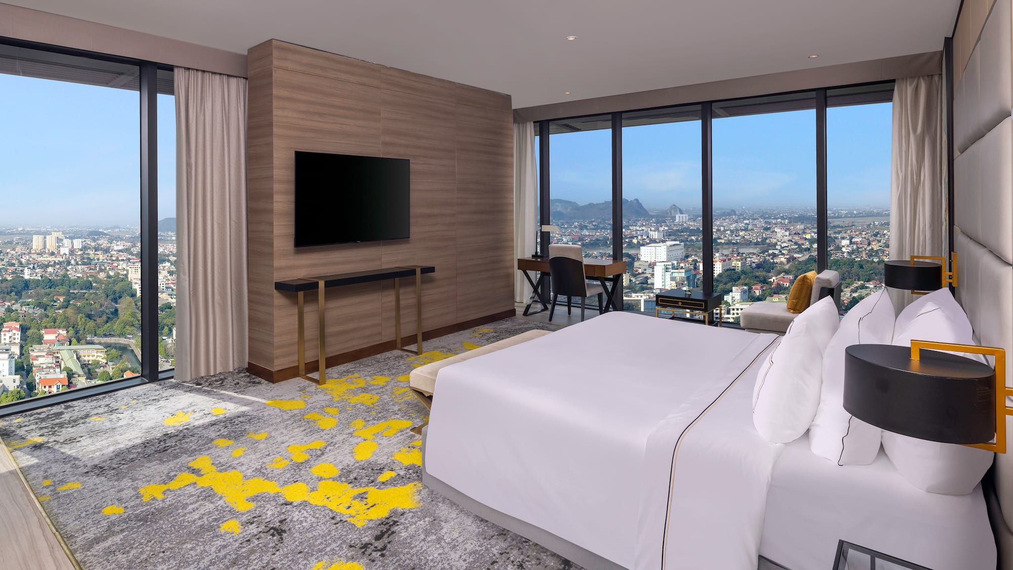 a room with a large window and a large bed