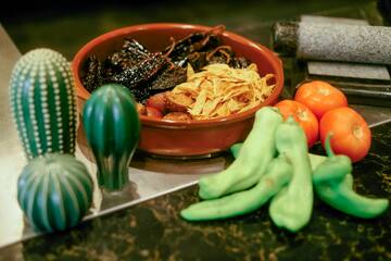 a bowl of food next to vegetables