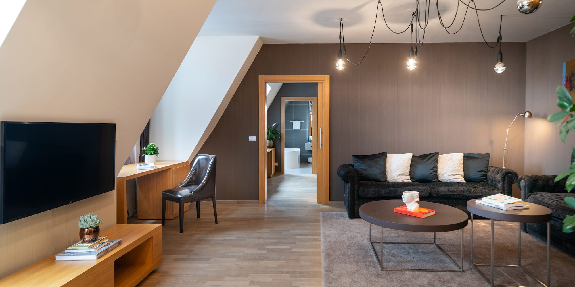 a living room with a couch and a tv