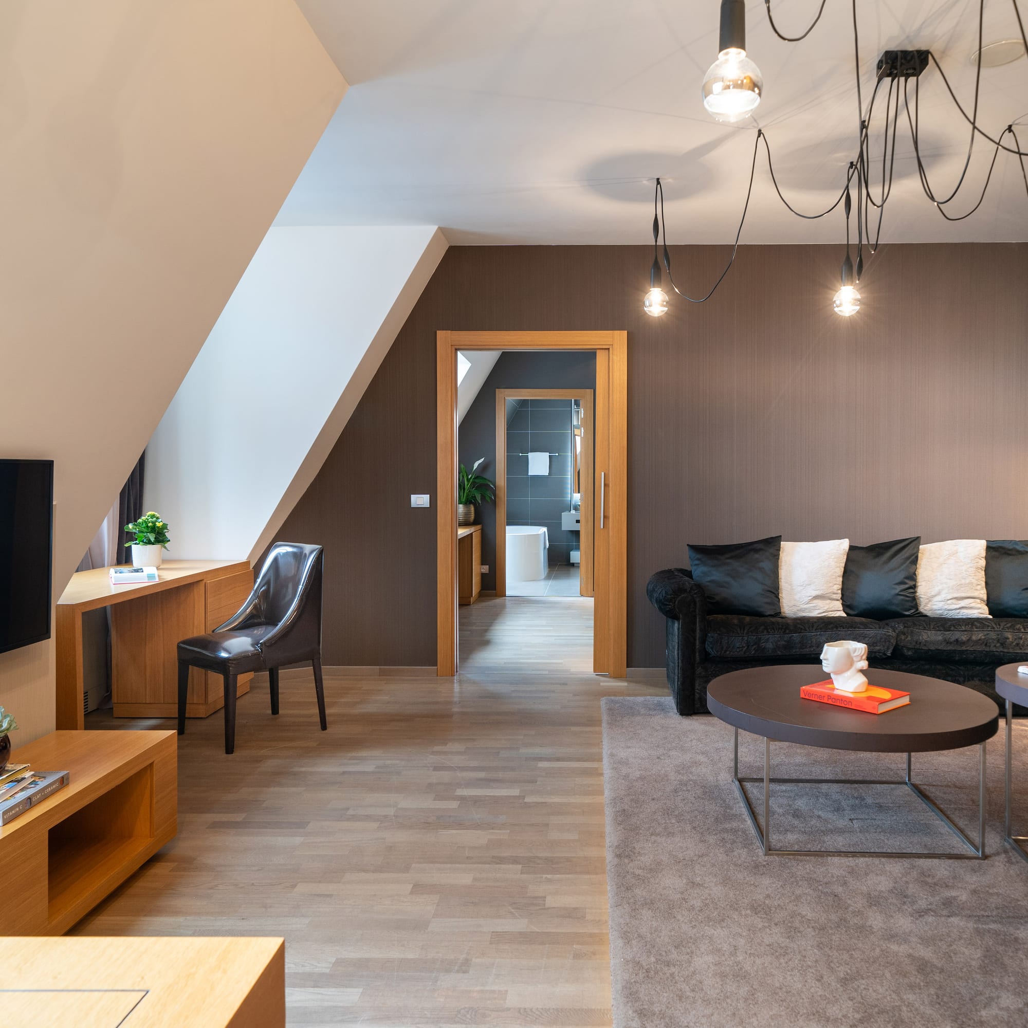 a living room with a couch and a tv