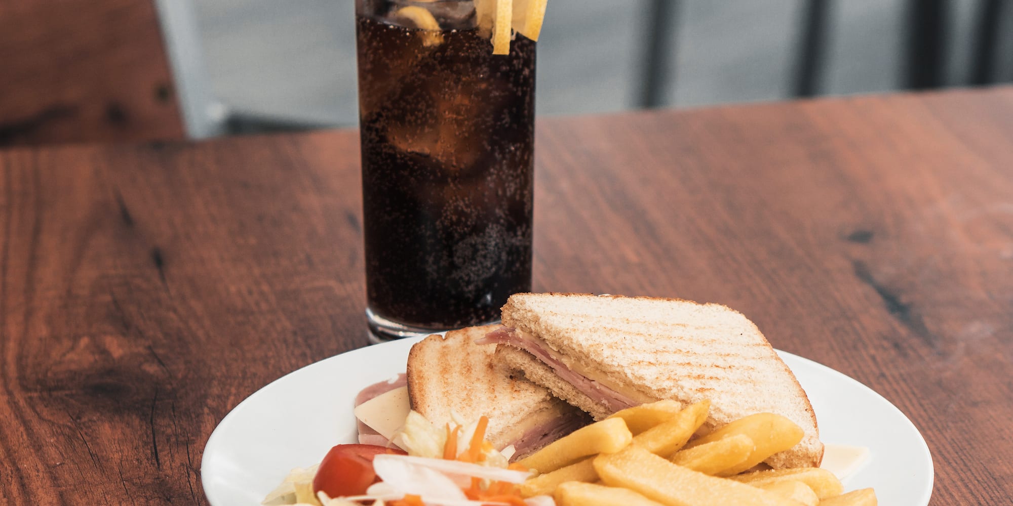 a plate of food and a drink on a table