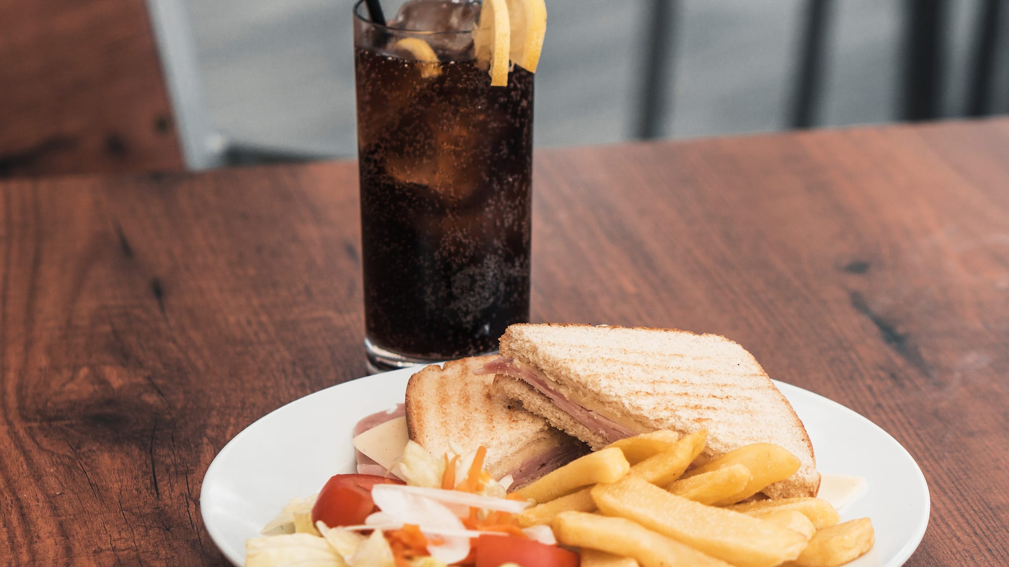 a plate of food and a drink on a table