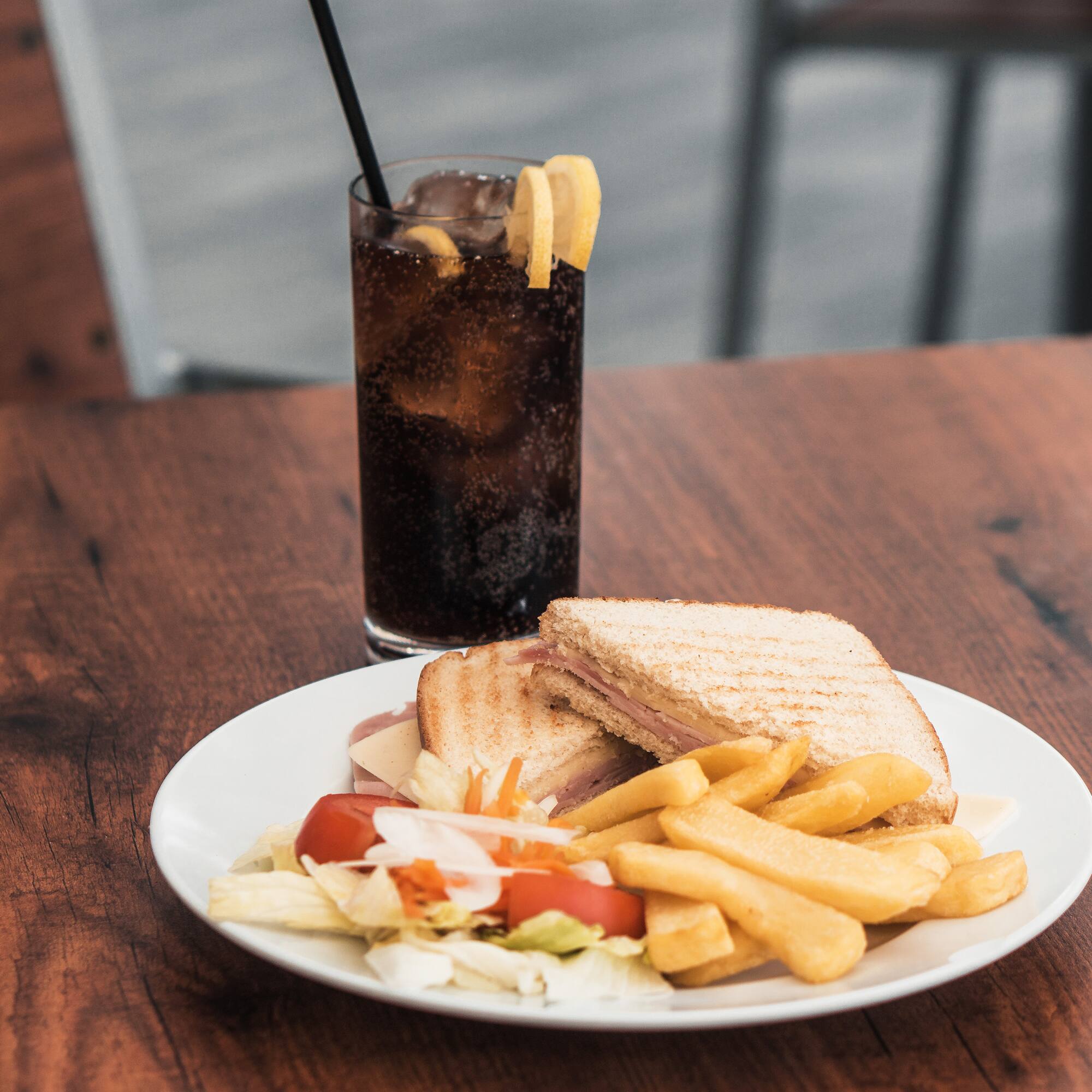 a plate of food and a drink on a table