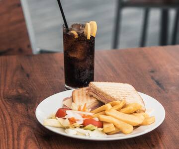 a plate of food and a drink on a table