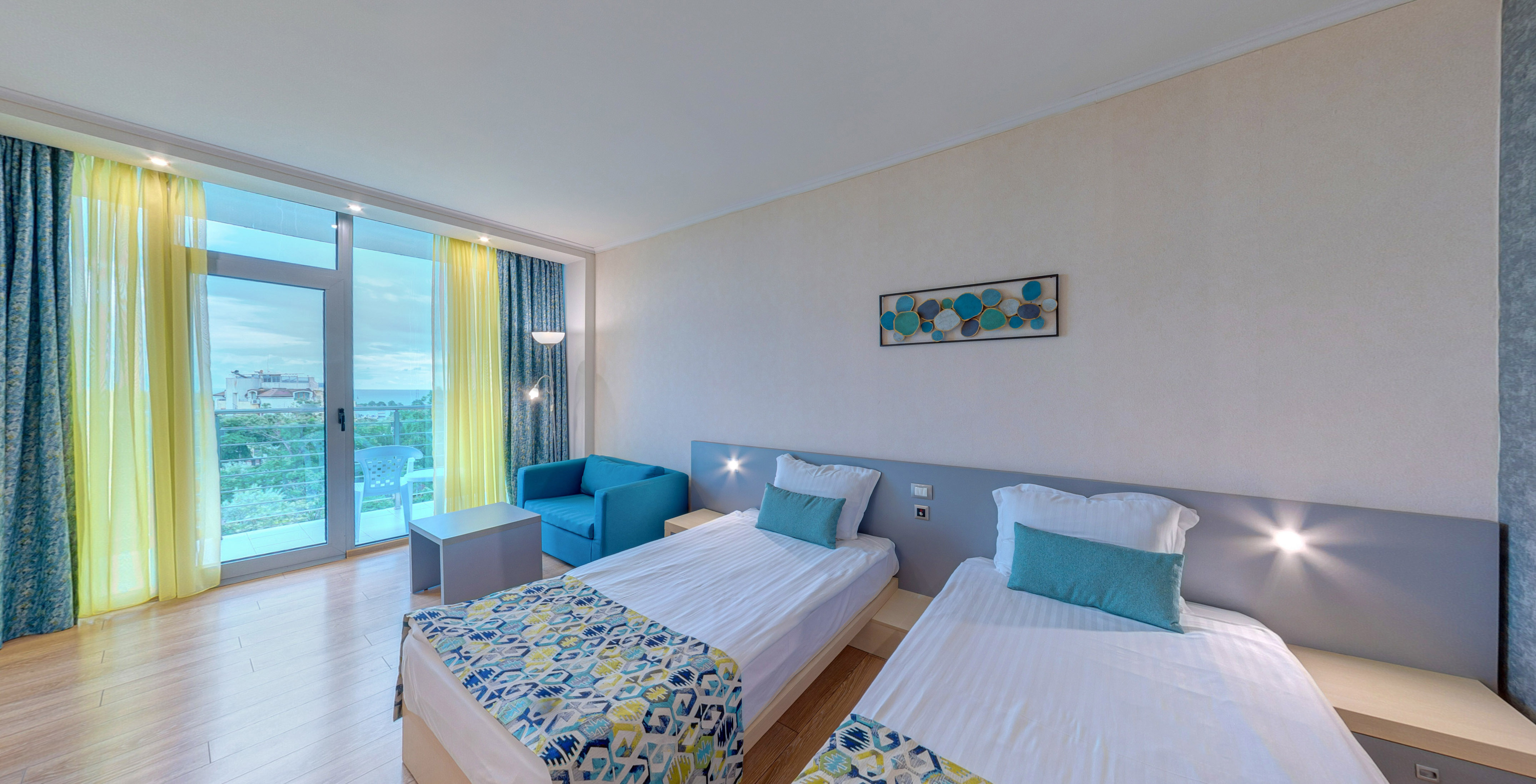 a room with two beds and a table