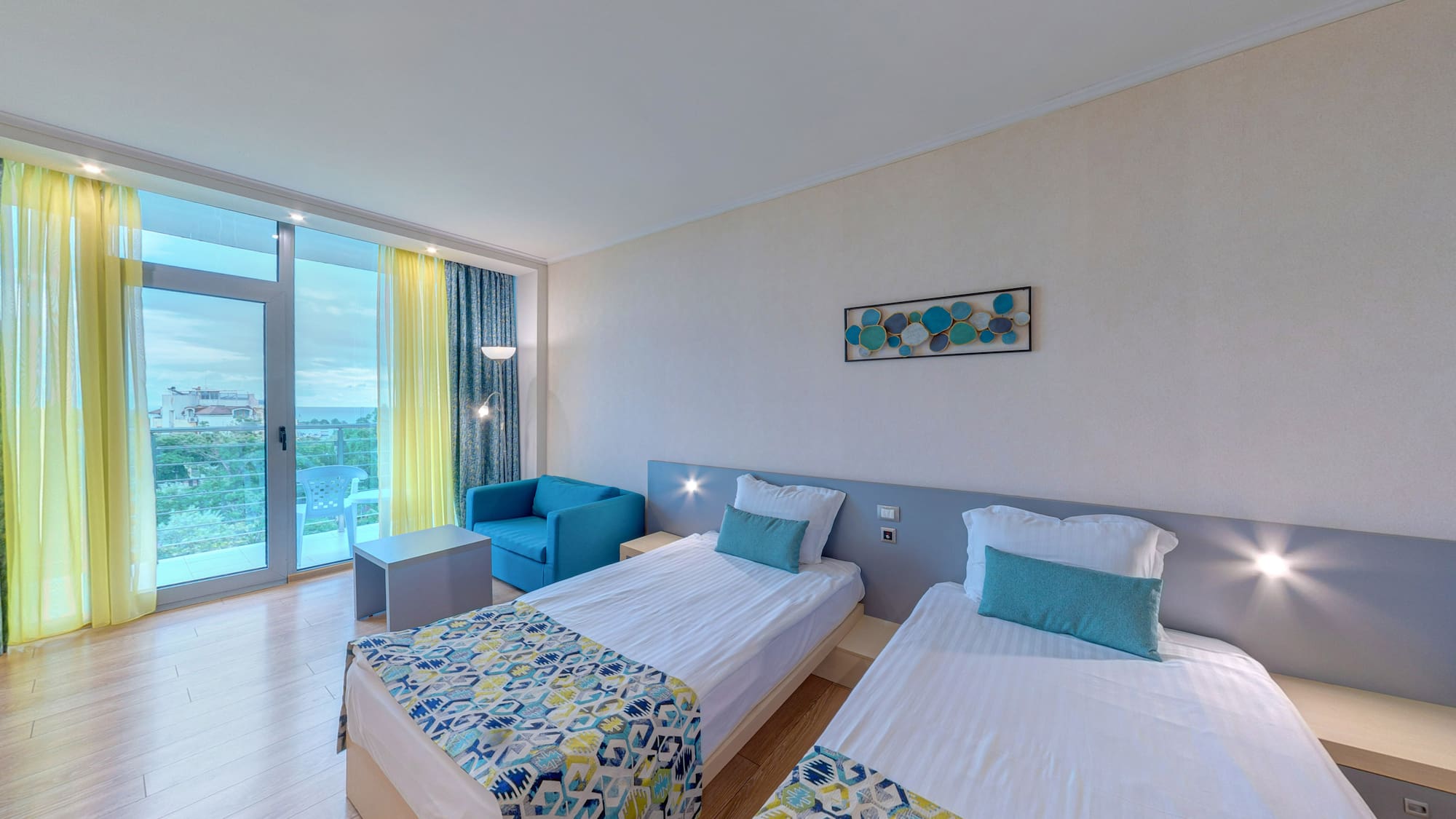 a room with two beds and a table
