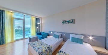 a room with two beds and a table