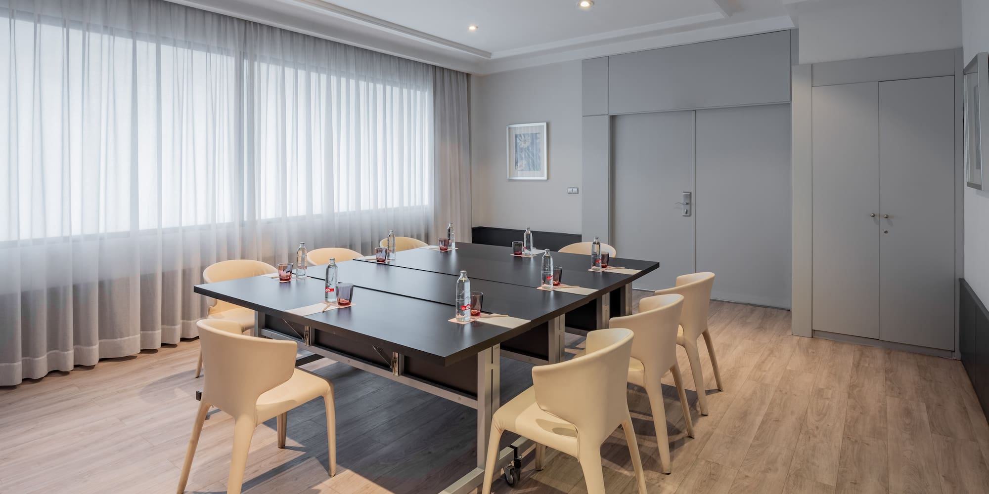 a conference room with a table and chairs