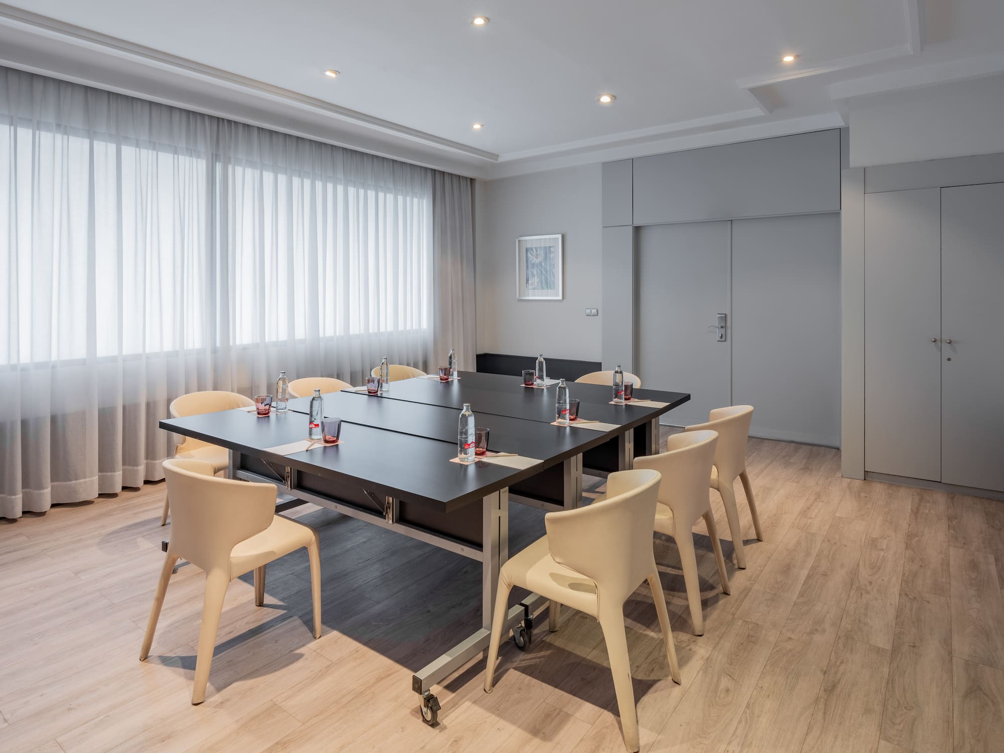 a conference room with a table and chairs