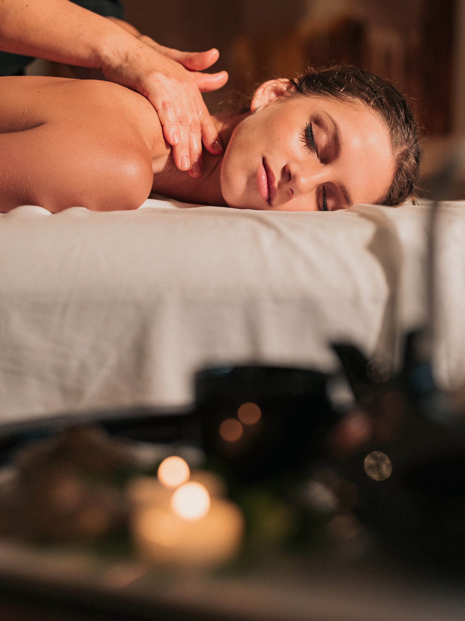 a woman lying on a massage table
